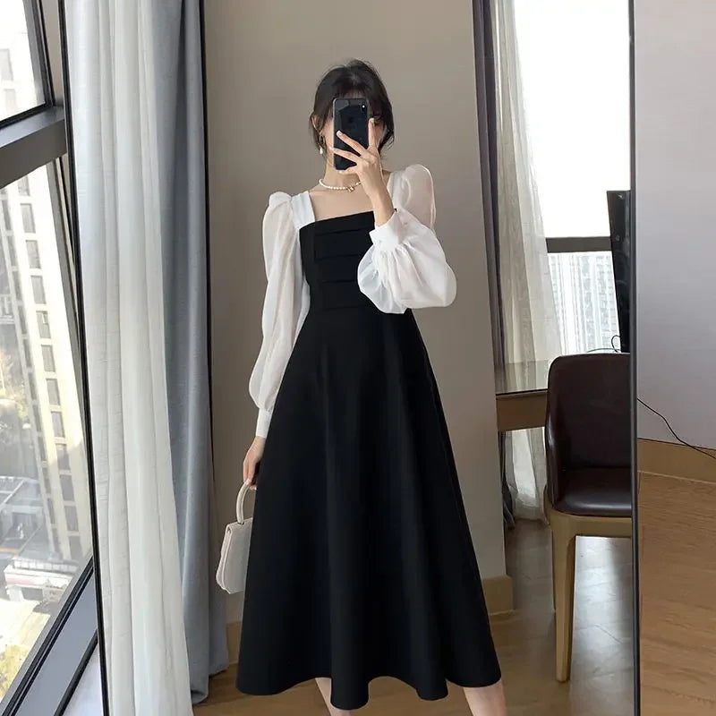 Neues, elegantes schwarzes Kleid für Frühling und Herbst im französischen Vintage-Stil. Mit langen Ärmeln, quadratischem Ausschnitt und dekorativer Schnürung.

