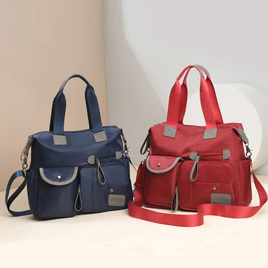 Stilvolle Damen Tote Bag aus wasserdichtem Nylon. Großes Fassungsvermögen, ideal als Schultertasche, Umhängetasche oder Mummy Bag.

