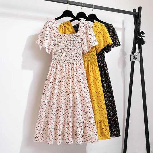 Modisches Chiffon-Kleid mit kurzen Ärmeln und elastischer Taille. Blumenprint und A-Linien-Schnitt für einen lässigen und bequemen Sommer- und Herbst-Look.

