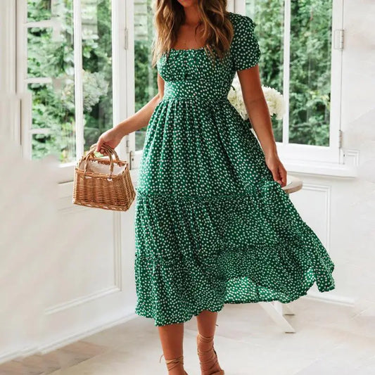 Elegantes und luftiges Sommerkleid mit kurzen Puffärmeln, Blumenmuster und quadratischem Ausschnitt. Perfekt für Strand, Partys und warme Tage. Ein Muss für Ihren Kleiderschrank!

